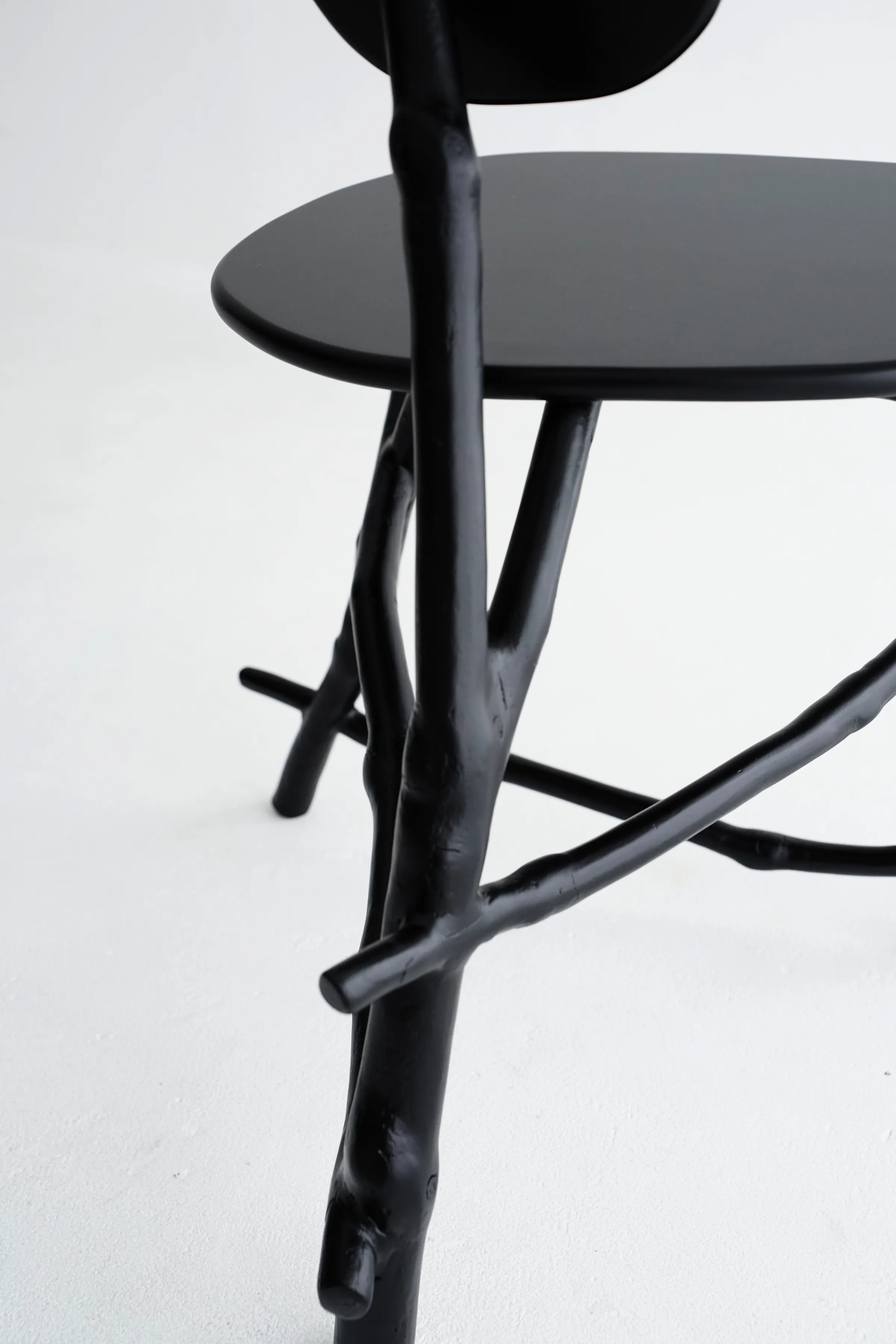 Uneri tall sculptural piece with organic branch structure painted matte black